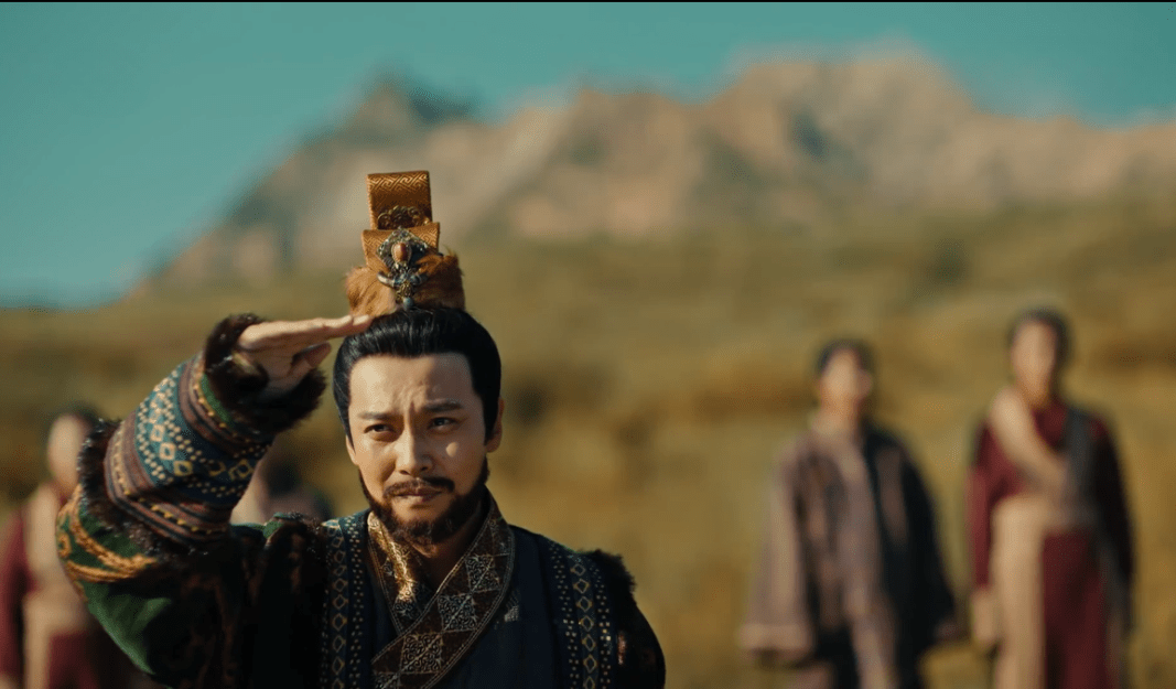 Depiction of King Tuoba Hong, dressed in ornate traditional attire, shielding his eyes as he looks into the distance, with mountains in the background.