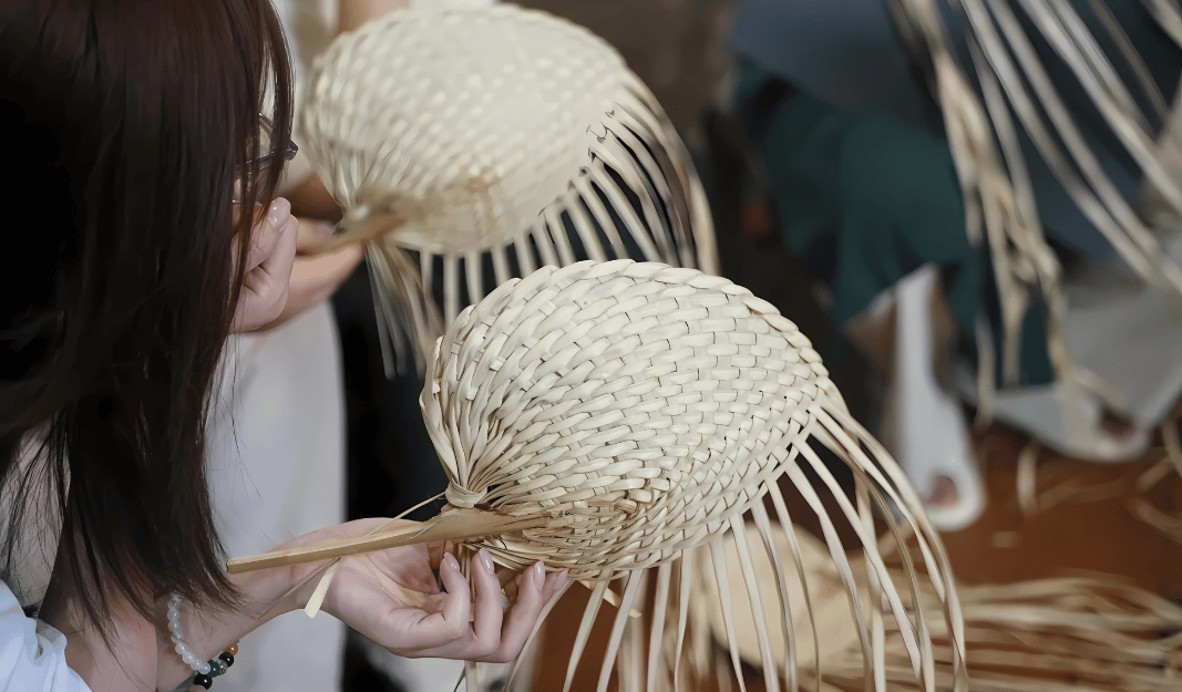 Young people learning traditional art of palm weaving (葵艺) in China.