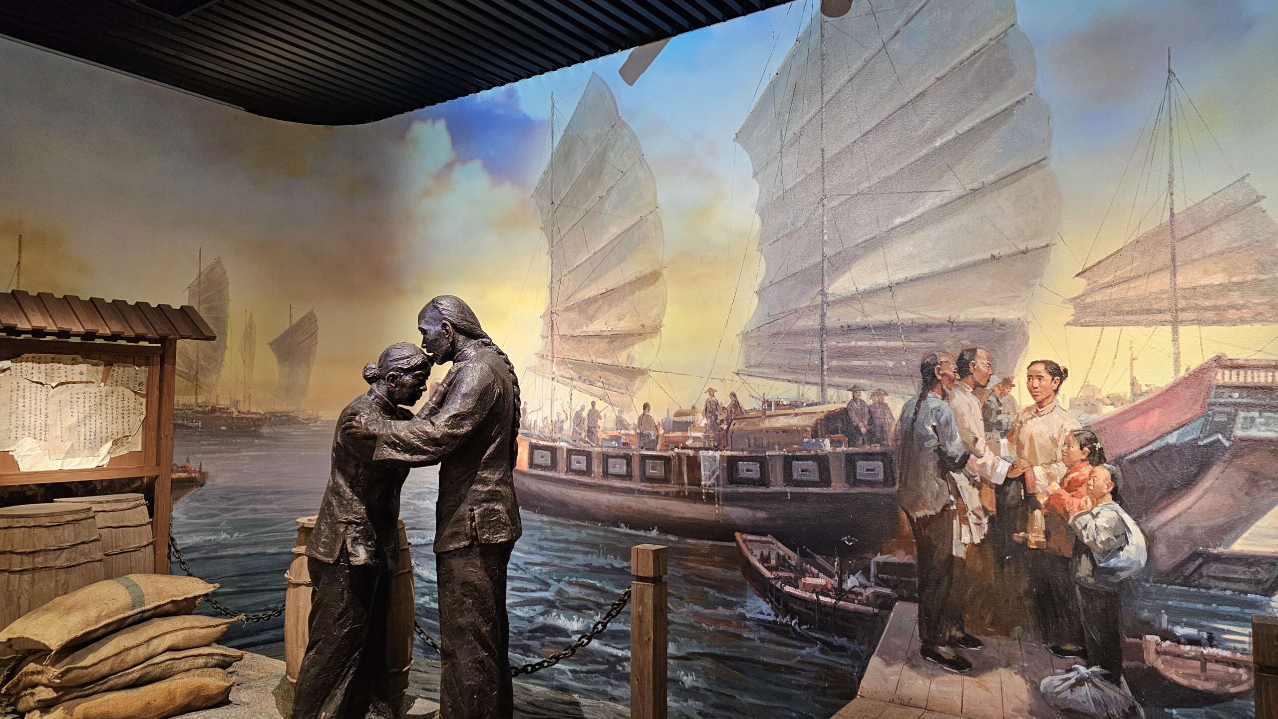 A solemn farewell scene at a harbor, capturing the emotional departure of Taishanese migrants as they board a ship bound for foreign shores.