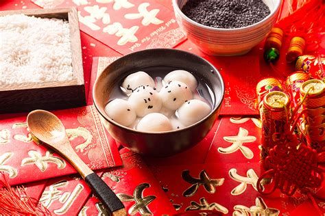 Traditional Tangyuan served during Chinese New Year on a festive red background.