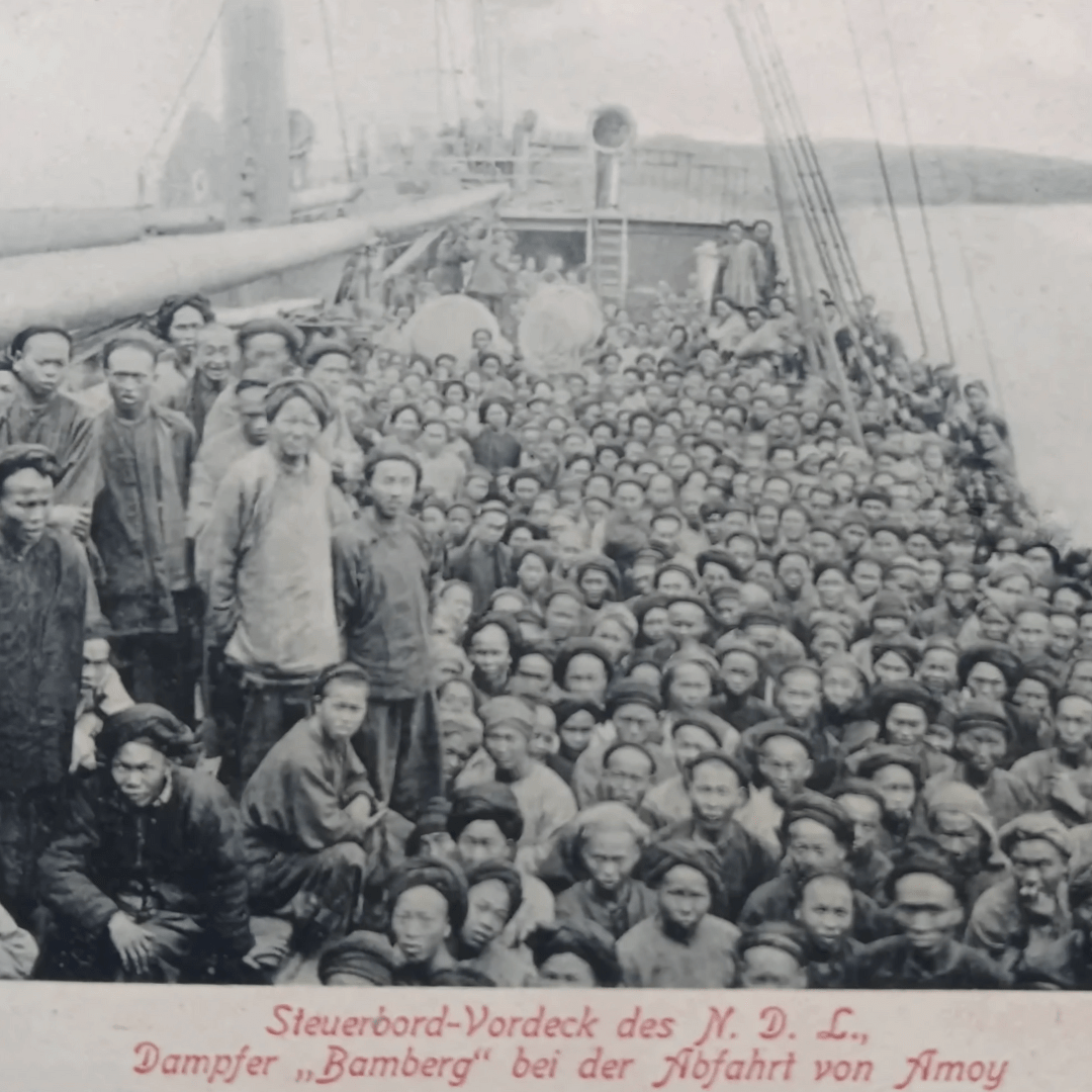 A historical image of an overcrowded Chinese labor ship, reflecting the mass migration following the end of slavery.