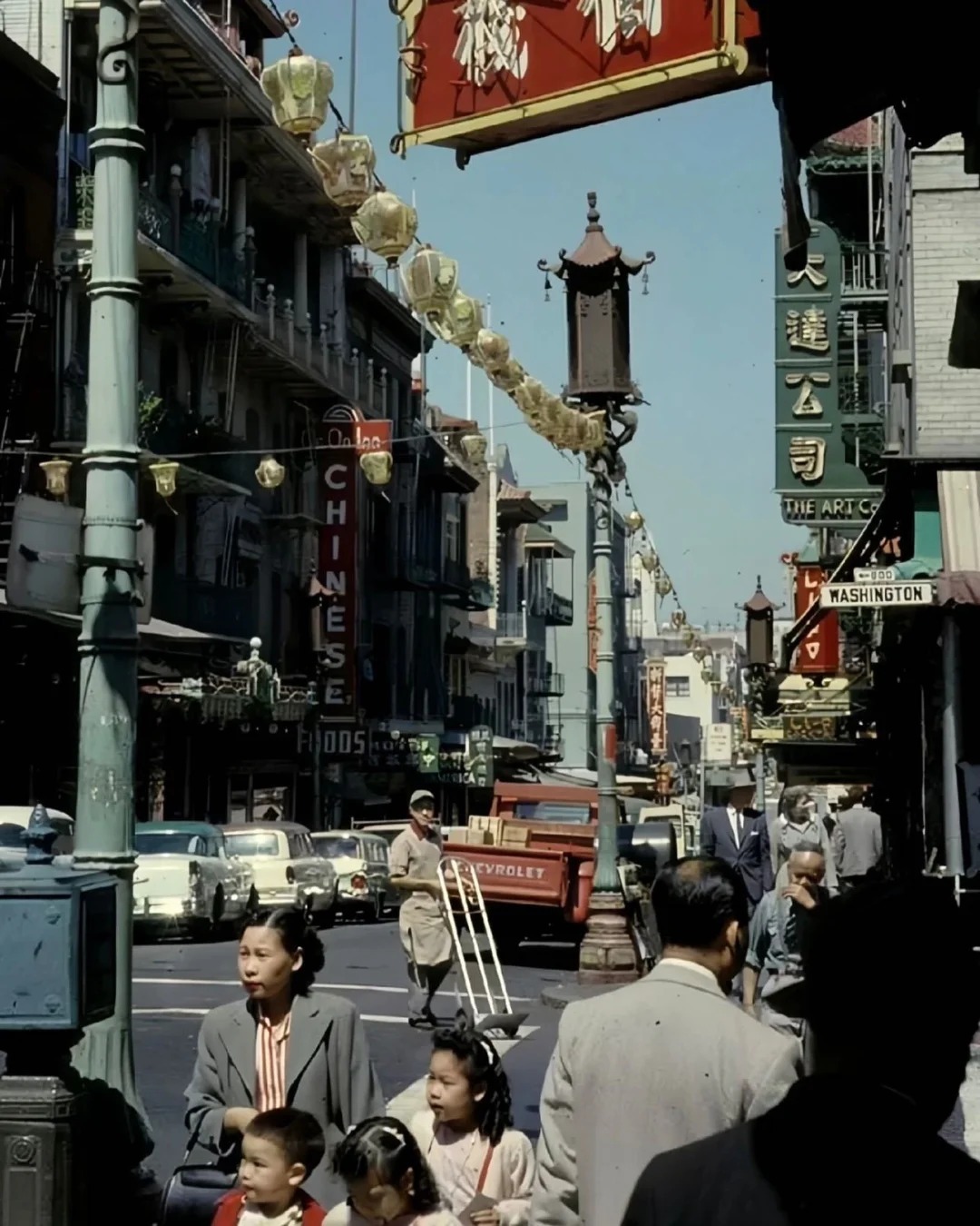 A vibrant street scene in San Francisco's Chinatown in the 1950s, showcasing the cultural resilience of Taishan women abroad.