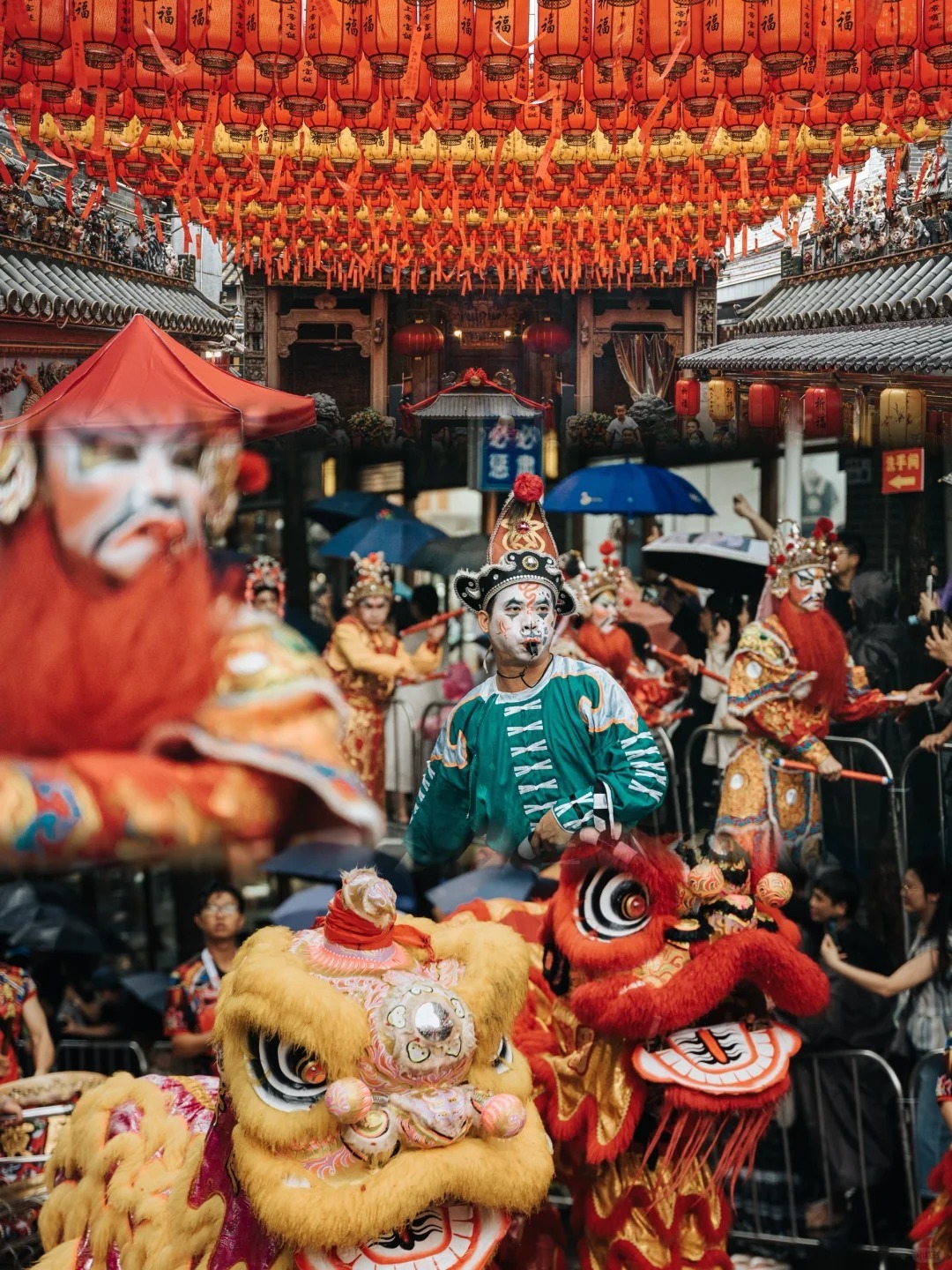 Traditional Chinese lion dance performers in vibrant costumes, symbolizing the cultural heritage that shaped Sun Yat-sen's early life and revolutionary journey.