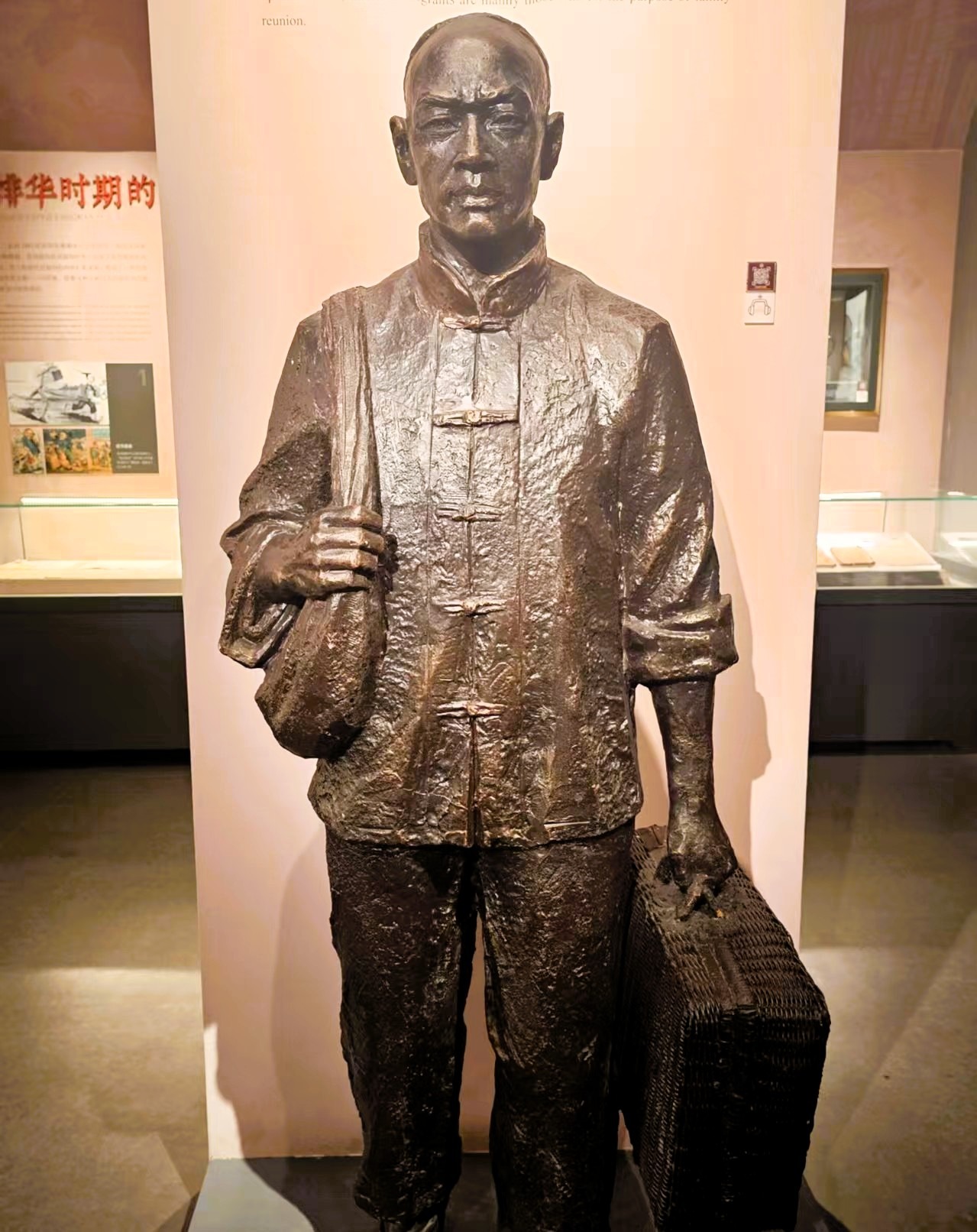 Bronze statue of a Chinese railroad worker with luggage, commemorating the resilience behind the Chinese railroad workers exclusion
