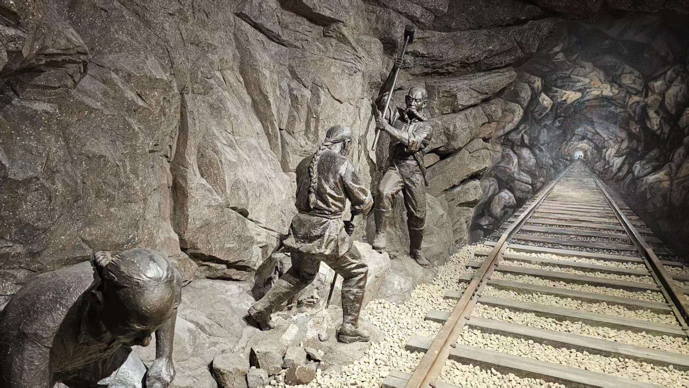 Statue of Chinese laborers carving railroad tunnels, depicting the hardship behind the Chinese railroad workers exclusion