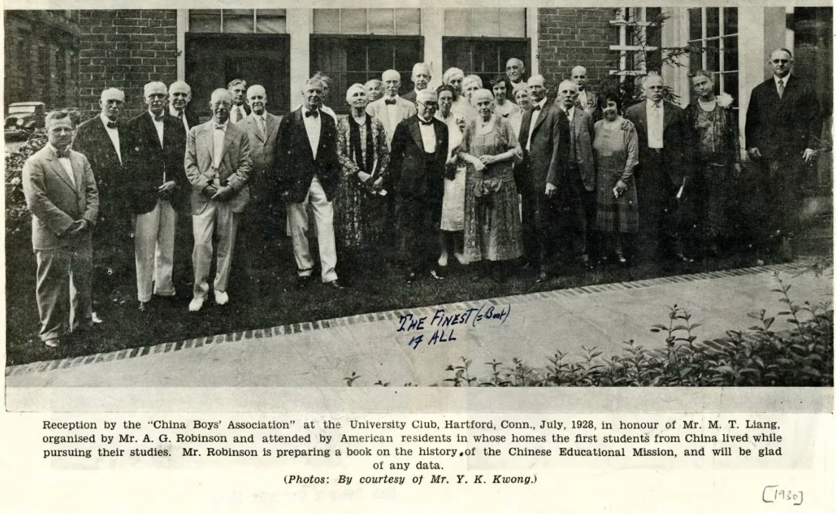 A black-and-white photograph of a group of people, including both Chinese and American individuals, gathered outside a building. The group includes older men and women, some in formal attire, commemorating an event related to the early Chinese students who studied in the United States.