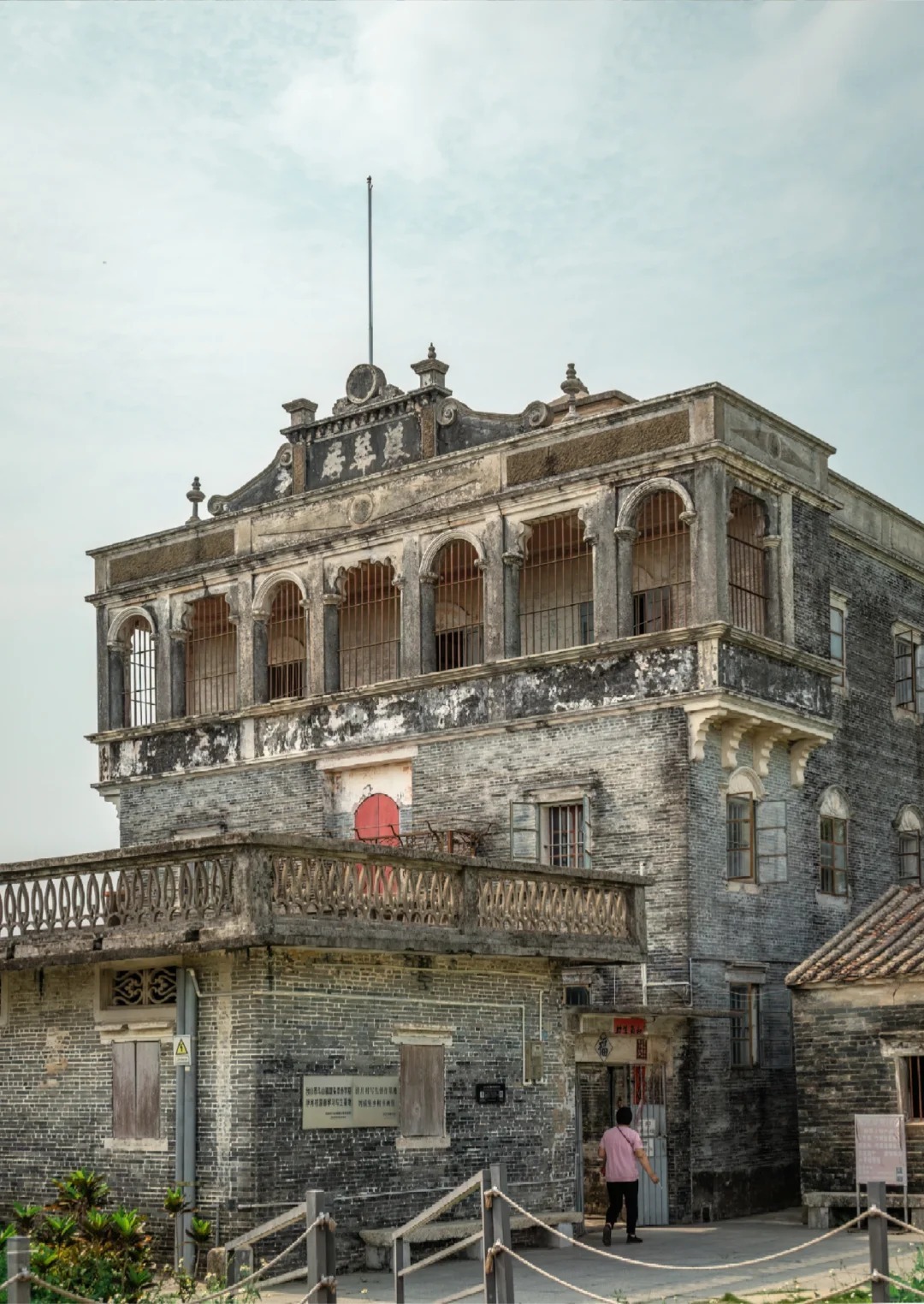 Historic Diaolou tower with arched balconies in rural China